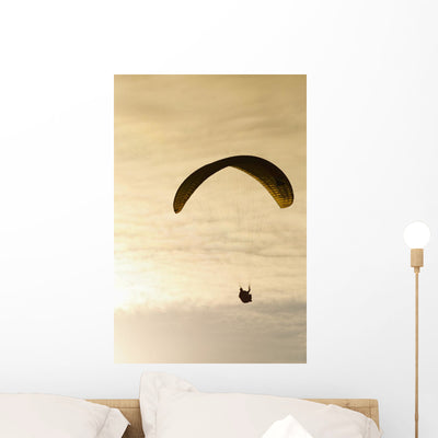 Paraglider Flying Front Vibrant Wall Mural shown on a wall