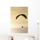 Paraglider flying in front of vibrant sunset EDITORIAL USE ONLY Wall Mural
