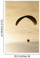 Paraglider flying in front of vibrant sunset EDITORIAL USE ONLY Wall Mural