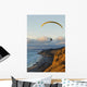 Paraglider flying over ocean cliffs at sunset EDITORIAL USE ONLY Wall Mural
