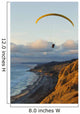 Paraglider flying over ocean cliffs at sunset EDITORIAL USE ONLY Wall Mural