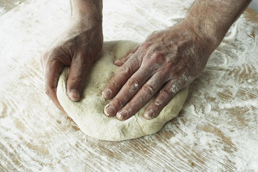 Close-Up Of Hands Kneading Dough Wall Mural