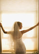 A Bride Pondering Her Big Day While Looking Out A Window Wall Mural