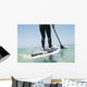 Paddling on a surfboard;Tarifa cadiz andalusia spain Wall Mural