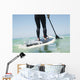 Paddling on a surfboard;Tarifa cadiz andalusia spain Wall Mural