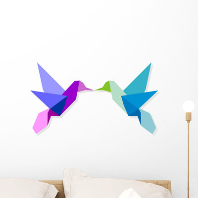Couple Colorful Origami Hummingbird shown on a wall