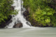A Cascading Waterfall Flows Into Granite Creek Wall Mural