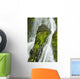 Waterfall Flows Over Green Foliage And Rock Outcrop Wall Mural
