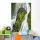 Waterfall Flows Over Green Foliage And Rock Outcrop Wall Mural