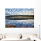 A Pattern Of Clouds Are Reflected Wall Mural