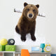 Captive Brown Bear Sitting In Snow Wall Mural