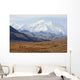 Three Caribou Run Thru The Tundra With Mt Mckinley Looming Wall Mural