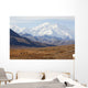 Three Caribou Run Thru The Tundra With Mt Mckinley Looming Wall Mural