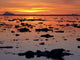 Scattered Ice On Turnagain Arm With Sun Setting Behind Mt Redoubt Wall Mural