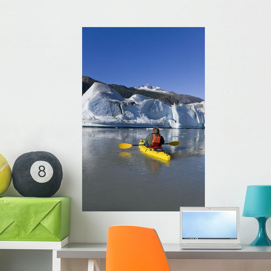 A Kayaker Paddles The Icy Waters Of Mendenhall Lake Wall Mural