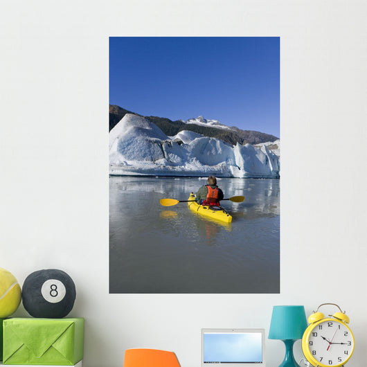 A Kayaker Paddles The Icy Waters Of Mendenhall Lake Wall Mural