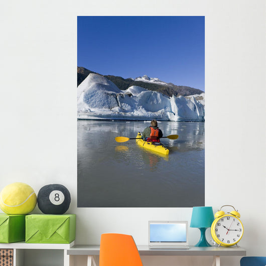 A Kayaker Paddles The Icy Waters Of Mendenhall Lake Wall Mural