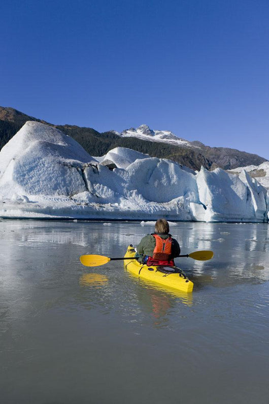 A Kayaker Paddles The Icy Waters Of Mendenhall Lake Wall Mural