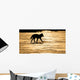 Silhouetted Archipelago Wolf Trotting Across Snow Field Wall Mural