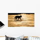Silhouetted Archipelago Wolf Trotting Across Snow Field Wall Mural