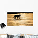 Silhouetted Archipelago Wolf Trotting Across Snow Field Wall Mural