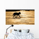 Silhouetted Archipelago Wolf Trotting Across Snow Field Wall Mural