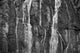 A Waterfall Cascades Over Rock Cliffs On The Juneau Ice Field Wall Mural