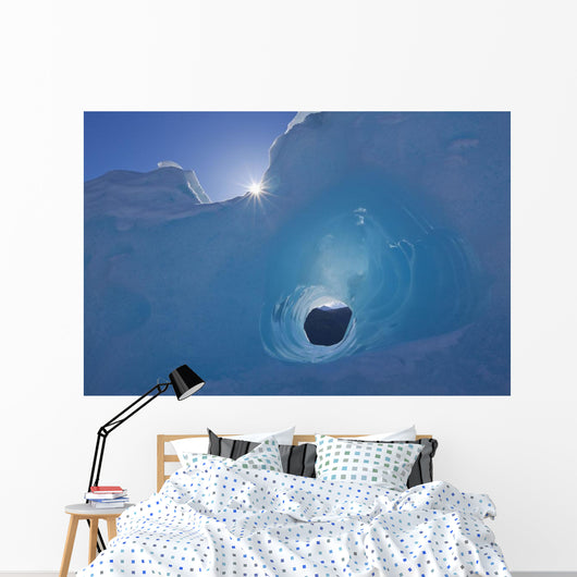 Small Tunnel Eroded In An Iceberg Frozen In Mendenhall Lake Wall Mural