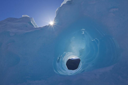 Small Tunnel Eroded In An Iceberg Frozen In Mendenhall Lake Wall Mural