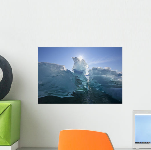 An Iceberg Floating On The Calm Waters Of Holkham Bay Wall Mural