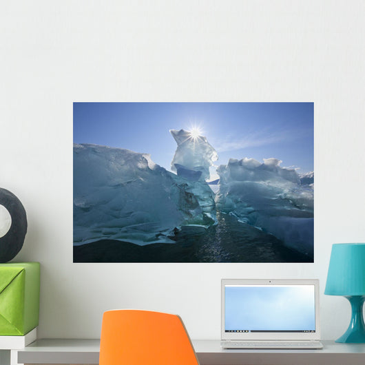 An Iceberg Floating On The Calm Waters Of Holkham Bay Wall Mural