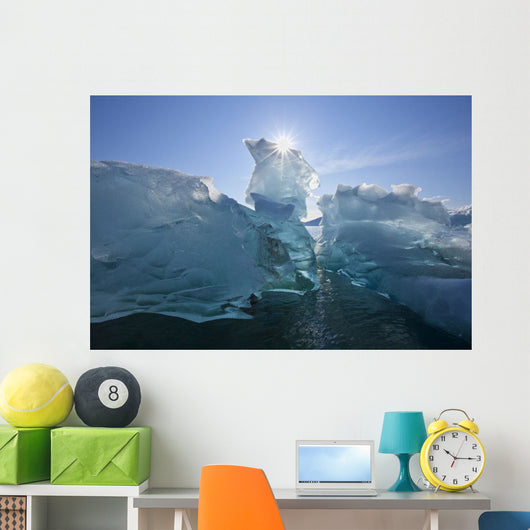 An Iceberg Floating On The Calm Waters Of Holkham Bay Wall Mural