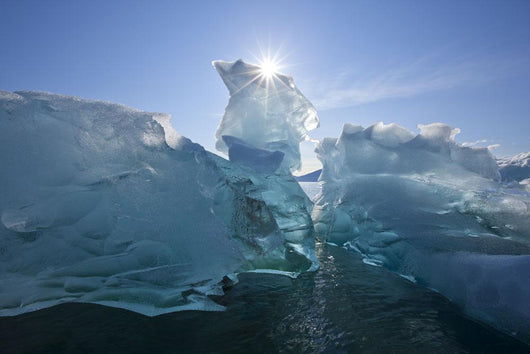 An Iceberg Floating On The Calm Waters Of Holkham Bay Wall Mural