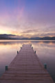 Footprints Leading Down A Frost Coverd Dock At Sunrise Wall Mural