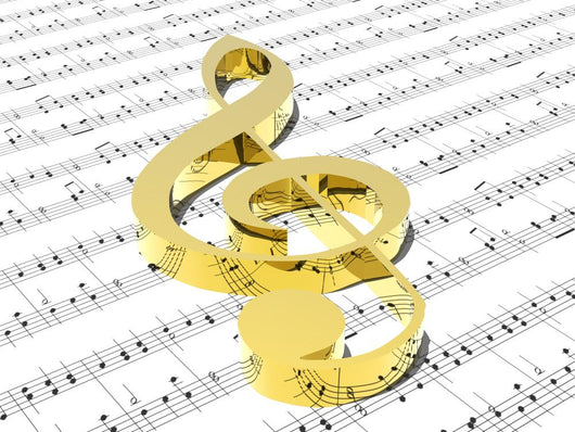 treble clef on sheet of printed music Wall Mural