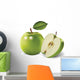 green apples and leaves on a white background Wall Mural