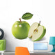 green apples and leaves on a white background Wall Mural