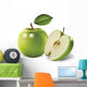 green apples and leaves on a white background Wall Mural