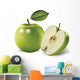 green apples and leaves on a white background Wall Mural