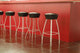 Black Stool in Interior of Bar on Ceramic Floor Wall Mural