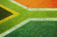 South African flag on football or rugby pitch Wall Mural