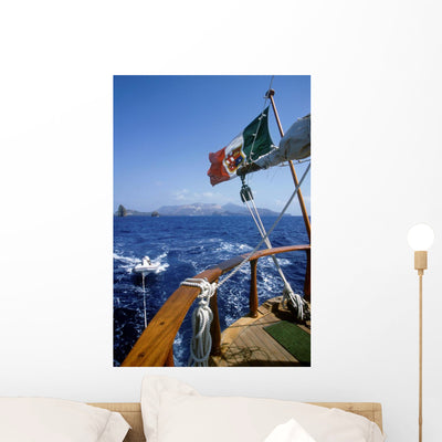 Sicilian Sailboat Wall Mural shown on a wall