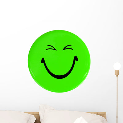 Green Happy Face Button Wall Decal shown on a wall