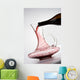 pouring red wine into decanter Wall Mural