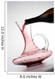 pouring red wine into decanter Wall Mural