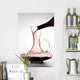 pouring red wine into decanter Wall Mural