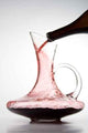 pouring red wine into decanter Wall Mural