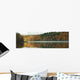 Autumn Coloured Trees Along The Shoreline Of A Lake Wall Mural