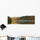 Autumn Coloured Trees Along The Shoreline Of A Lake Wall Mural