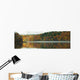 Autumn Coloured Trees Along The Shoreline Of A Lake Wall Mural